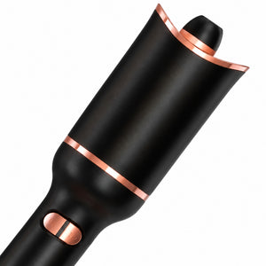 Close-up of the black curling chamber and rose-gold direction buttons on the automatic hair curler