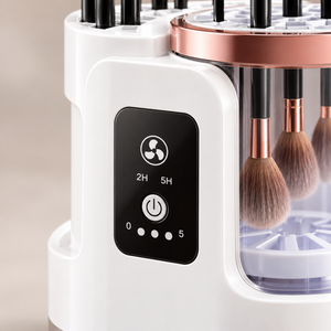 Close-up of the makeup brush cleaner control panel and clear cleaning chamber.