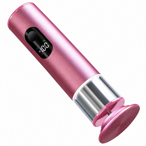 Pink rechargeable electric foot file with digital display and rotating disc on a clean white background.