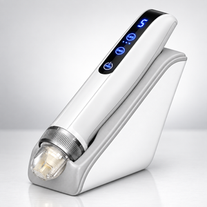 Microneedling pen resting on its white induction base