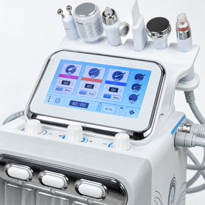 Close-up of the facial system touchscreen, chrome surround and front adjustment knobs.