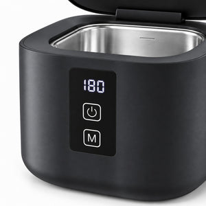 Close-up of the ultrasonic cleaner digital timer display and front control buttons
