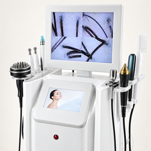 Close-up of the scalp-care workstation display, control screen and mounted treatment handpieces