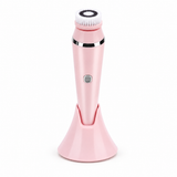 Pink facial cleansing brush on a white background
