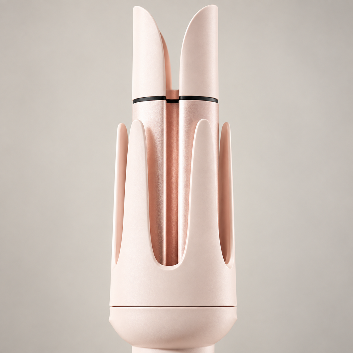 Detail of the pink curler protective barrel housing and ceramic-coated curling surface.