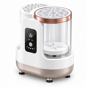 White electric makeup brush cleaner with clear chamber and rose-gold trim on a white background.