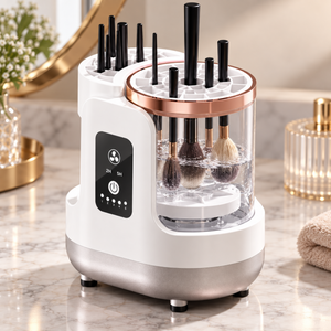Makeup brush cleaner demonstrating brush placement in the clear chamber; brushes shown for illustration.