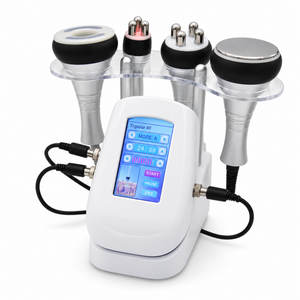 Four-handpiece beauty system with white touchscreen console, clear holder and original silver and black heads on white background.