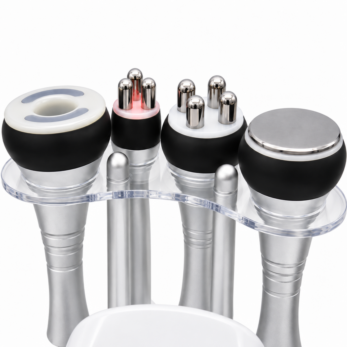 Close-up of the four original ultrasound, RF and vacuum handpieces in their clear acrylic holder.
