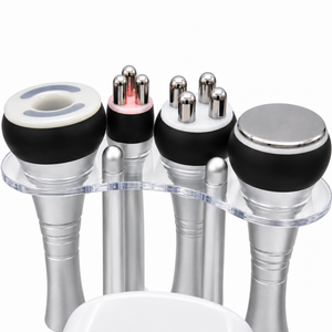 Close-up of the four original ultrasound, RF and vacuum handpieces in their clear acrylic holder.