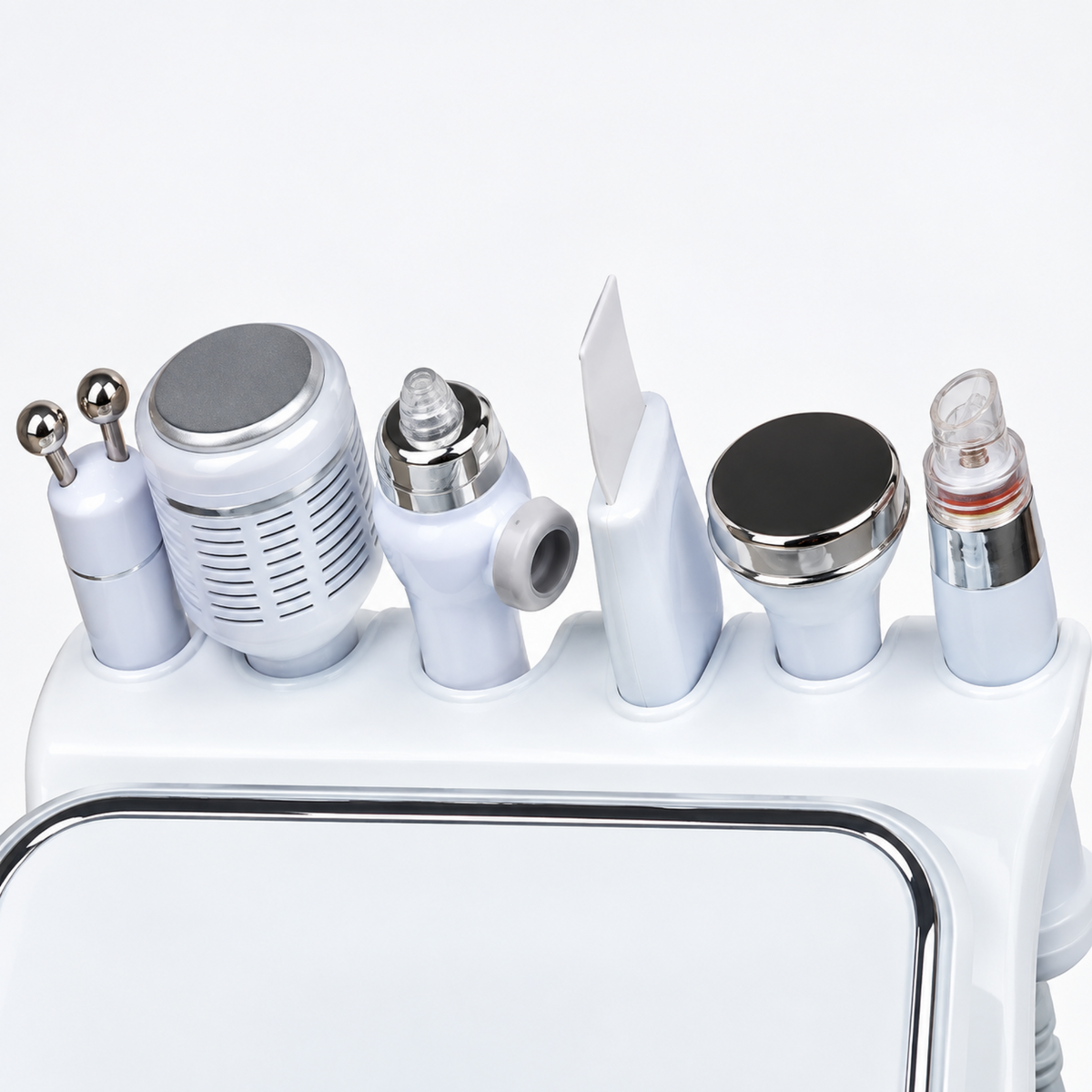 Close-up of the six supplied facial handpieces stored in their integrated white holder.