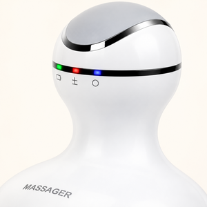 Close-up of the scalp massager controls and smooth white handheld grip