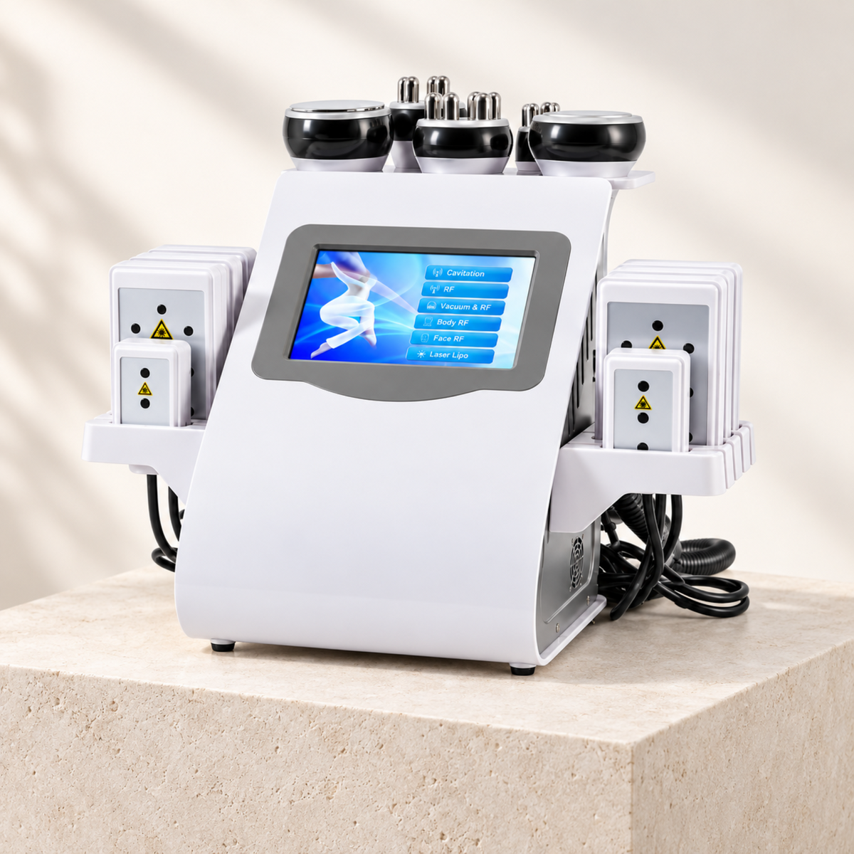 Six-in-one beauty system displayed on a pale stone platform
