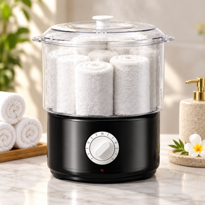 Black towel steamer showing the transparent upper chamber and front timer control.