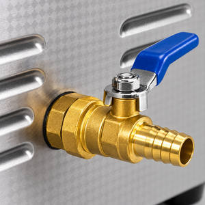 Detail of the brass drain valve with its blue lever and ridged outlet on the ultrasonic cleaner.