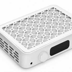 Close-up of the patterned removable grille and filter area of the nail dust collector