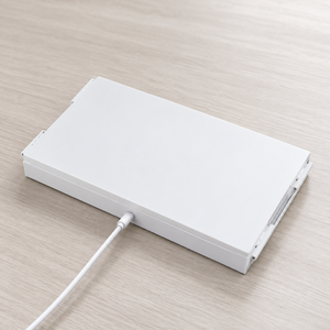 Folded white tri-fold mirror with its charging cable connected