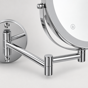 Close-up of the wall mirror folding arm and central pivot